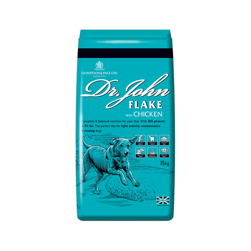 White background with an blue bag of Dr.John Flake with Chicken dry food. Pictured on the bag is an illustrated Labrador dog in a farm field. 