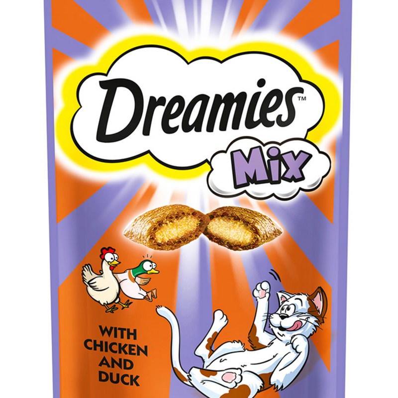 White background with a close up of a purple and orange packet of Dreamies with Chicken and Duck pictured. On the packet is an illustrated cartoon cat on it's back with an image of the treats above it and an illustrated chicken and duck. Text on the pack reads 'Dreamies, soft inside, crunchy outside, with Chicken and Duck.' 