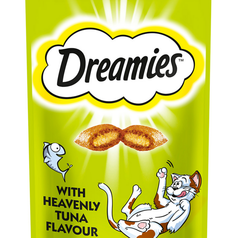 White background with a close up of a green packet of Dreamies with Heavenly Tuna pictured. On the packet is an illustrated cartoon cat on it's back with an image of the treats above it and an illustrated fish. Text on the pack reads 'Dreamies, soft inside, crunchy outside, with Heavenly Tuna.' 