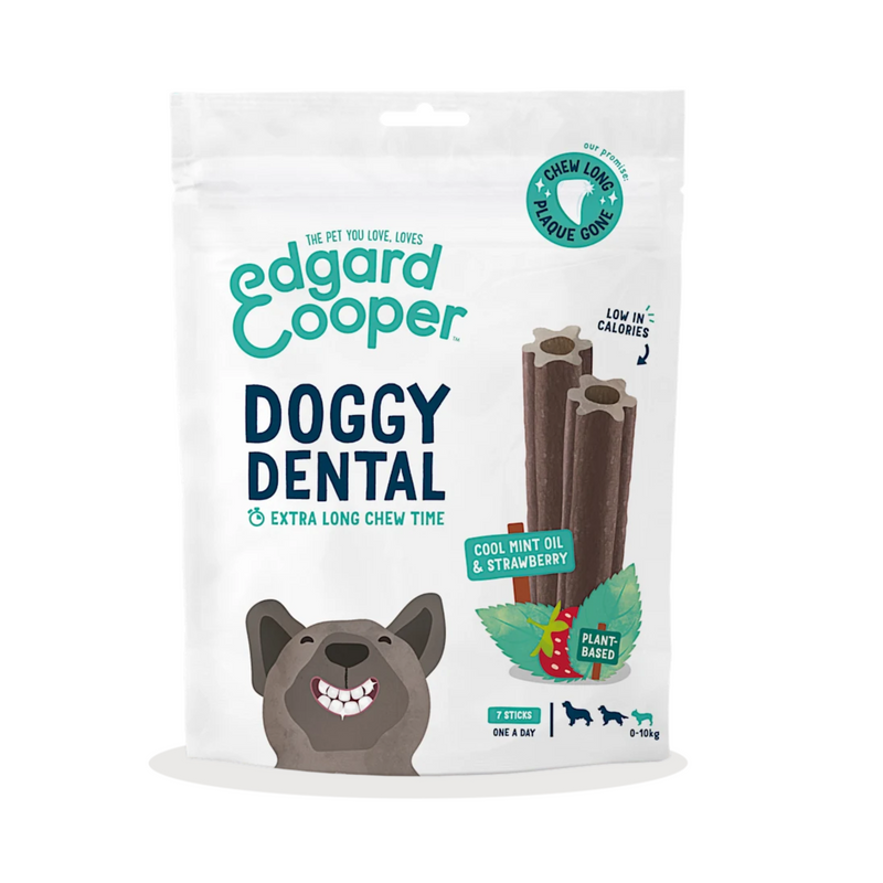 White background with a packet of Edgard & Cooper Doggy Dental Sticks pictured. On the packet is an illustrated French Bulldog with a teethy grin. Text on the pack reads, 'Edgard & Cooper, Doggy Dental, Extra Long Chew Time' with a picture of a stick treat to the right, text next to it reads 'Cool Mint Oil & Strawberry. Plant based.'  