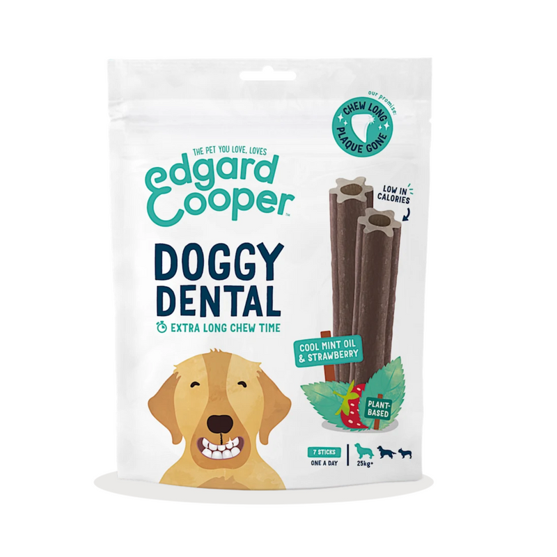 White background with a packet of Edgard & Cooper Doggy Dental Sticks pictured. On the packet is an illustrated Labrador with a teethy grin. Text on the pack reads, 'Edgard & Cooper, Doggy Dental, Extra Long Chew Time' with a picture of a stick treat to the right, text next to it reads 'Cool Mint Oil & Strawberry. Plant based.'  