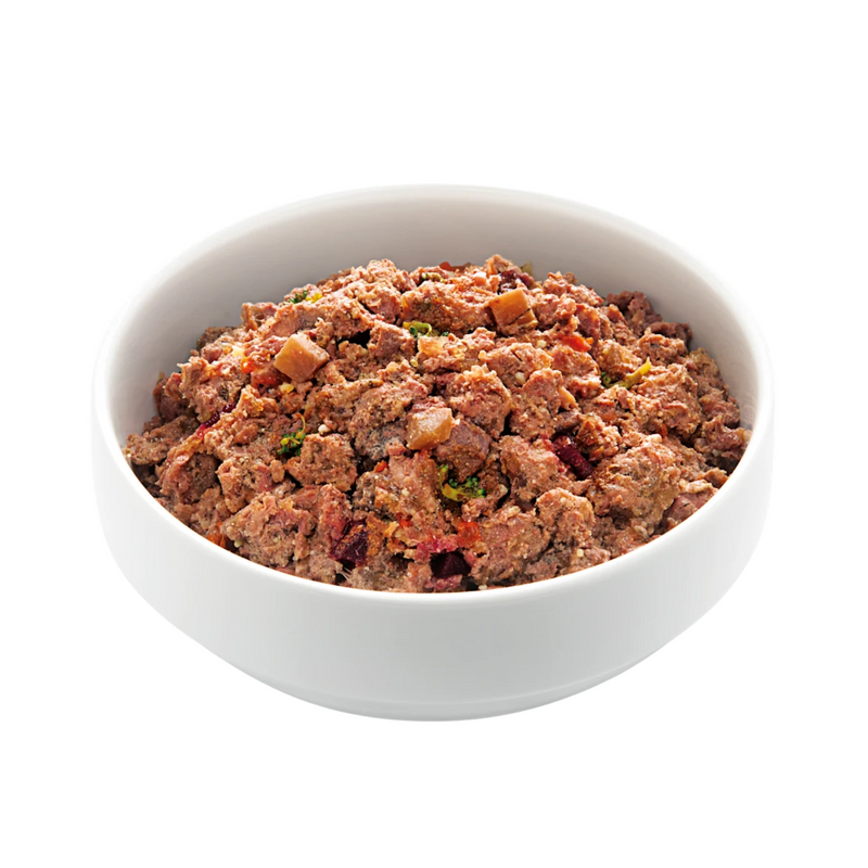 White background with a white bowl of Edgard and Cooper wet dog food pictured. 