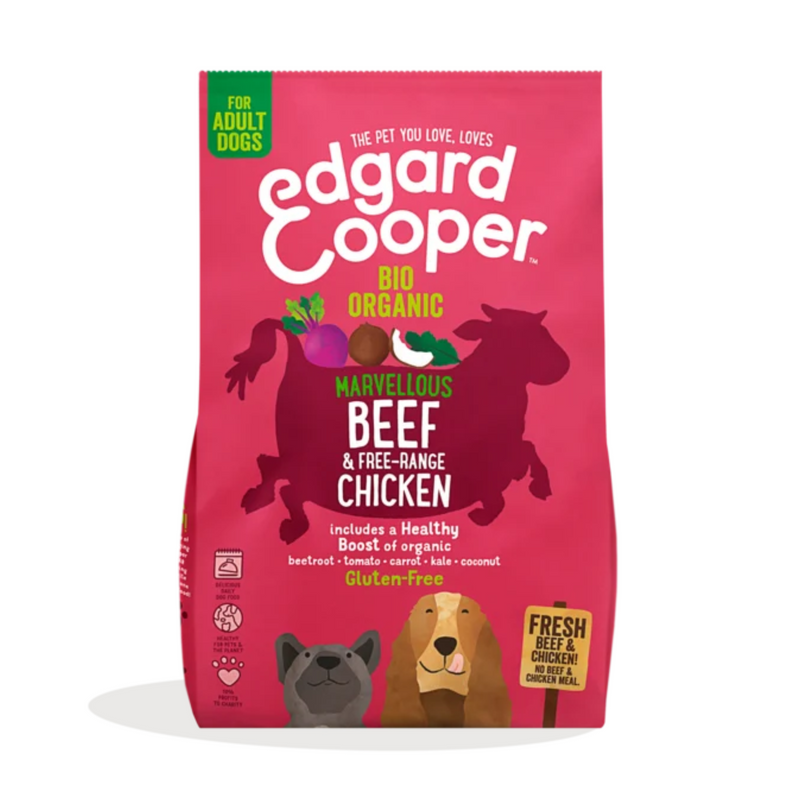 White background with an pink bag of Edgard & Cooper Organic Adult Dog Dry Food Beef and Chicken pictured. On the packet is an illustrated French Bulldog and Cocker Spaniel. Text on the pack reads, 'Edgard & Cooper.' A silhouette of a cow has text inside 'Marvellous Beef & Free-range Chicken' and 'Gluten Free' below. 