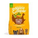 White background with an yellow bag of Edgard & Cooper Organic Adult Dog Dry Food Chicken pictured. On the packet is an illustrated French Bulldog and Cocker Spaniel. Text on the pack reads, 'Edgard & Cooper.' A silhouette of a turkey has text inside 'Luscious Free-Range Turkey & Chicken' and 'Gluten Free' below. 