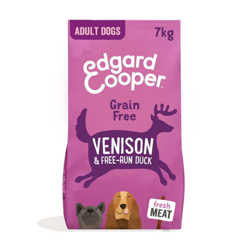 White background with a purple bag of Edgard & Cooper Adult Dog Dry Food Venison and Duck pictured. On the packet is an illustrated French Bulldog and Cocker Spaniel. Text on the pack reads, 'Edgard & Cooper.' A silhouette of a deer has text inside 'Fresh Venison & Duck' and 'Grain Free' above. 