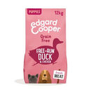 White background with an pink bag of Edgard & Cooper Puppy Dry Food Duck and Chicken pictured. On the packet is an illustrated French Bulldog and Cocker Spaniel puppy. Text on the pack reads, 'Edgard & Cooper.' A silhouette of a duck has text inside 'Fresh Duck and Chicken'.