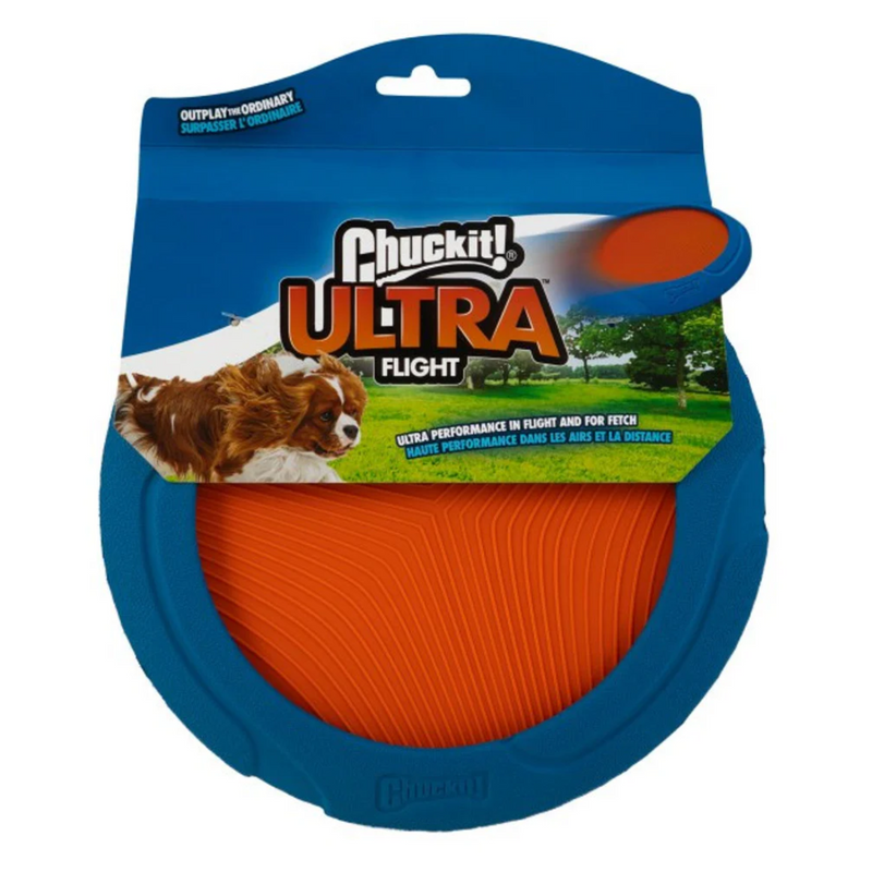 Frisbee style toy with a blue rudder outer rim and orange nylon inside, pictured in a cardboard sleeve with a brown and white dog chasing a picture of the frisbee, with text saying 'Chuckit! Ultra Flight' and 'Ultra performance in flight and for fetch' all on a white background. 