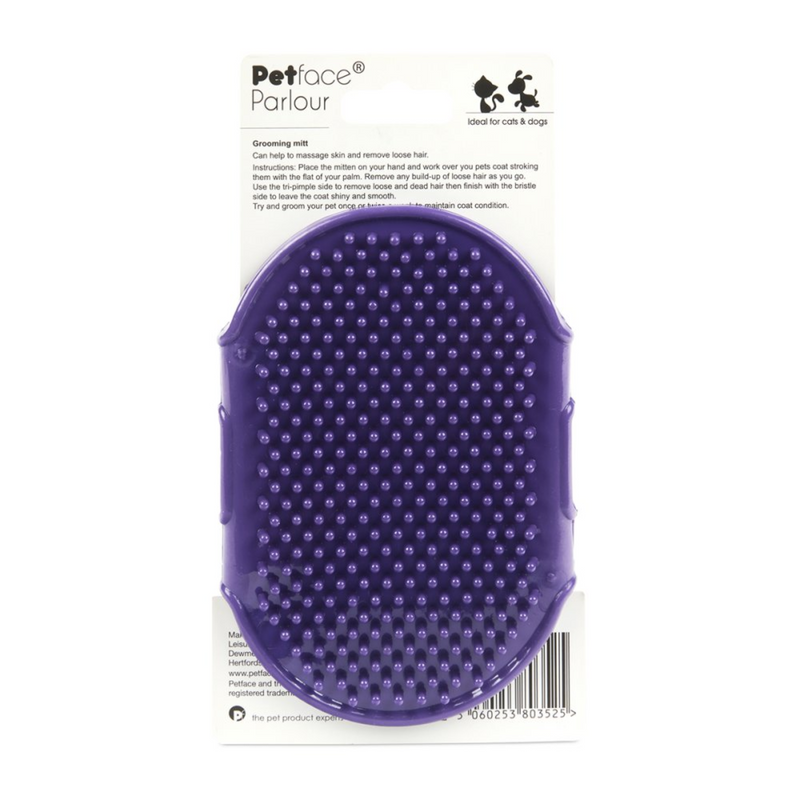Purple rubber grooming mitt, packed on a cardboard sleeve on a white background. 