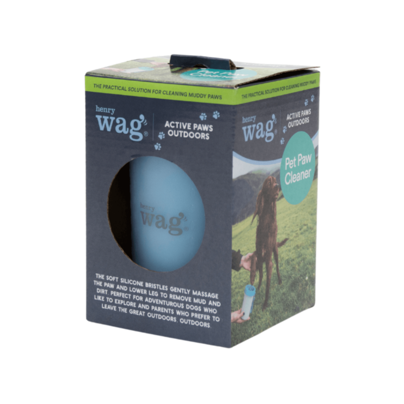 White background with a box for a Henry Wag pet paw cleaner, pictured on the box is a red setter out in a field with its paw being cleaned using the paw cleaner. Circular cut out shows the blue paw cleaner inside. 