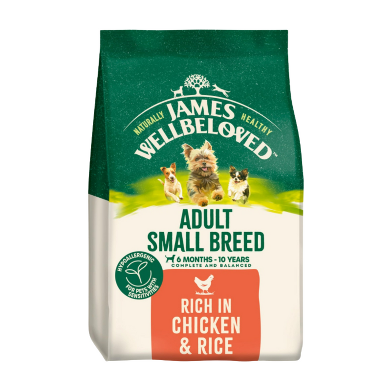 White background with a bag of James Wellbeloved Small Breed Chicken & Rice Dog Food. Packaging is green and cream with small breed 3 dogs pictured, with text 'Adult Small Breed, Dog 6 months - 10 years, Rich in Chicken and Rice'. 