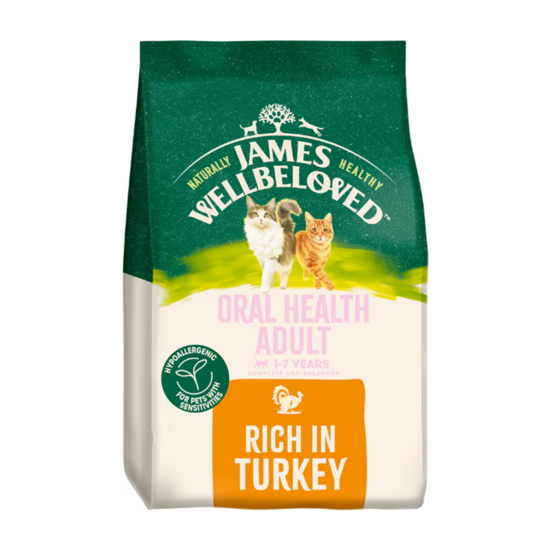 White background with a bag of James Wellbeloved Oral Health Turkey Cat Food. Packaging is green and cream with 2 cats pictured, with text 'Oral Health Adult, 1-7years, Rich in Turkey'. 