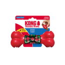 White background with a KONG red bone with a tartan bow motif in the centre attached to a cardboard backing with text 'KONG Goodie Bone', 'Durable, natural rubber'. 