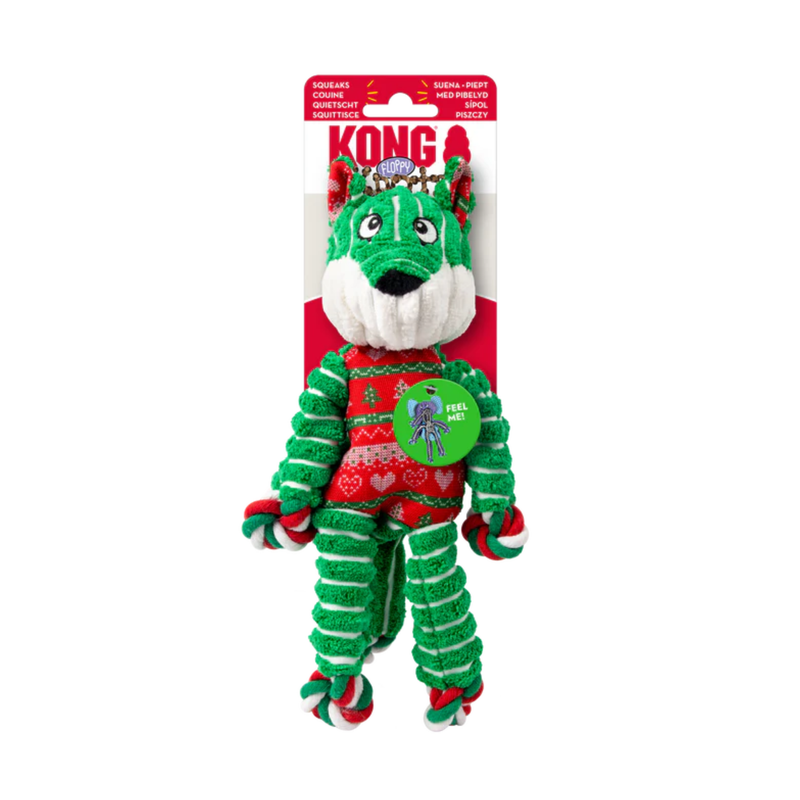 Green, red and white stripy fabric and rope Fox Dog Toy with Christmas tree fabric ears and belly attached to a cardboard backing, pictured on a white background. 