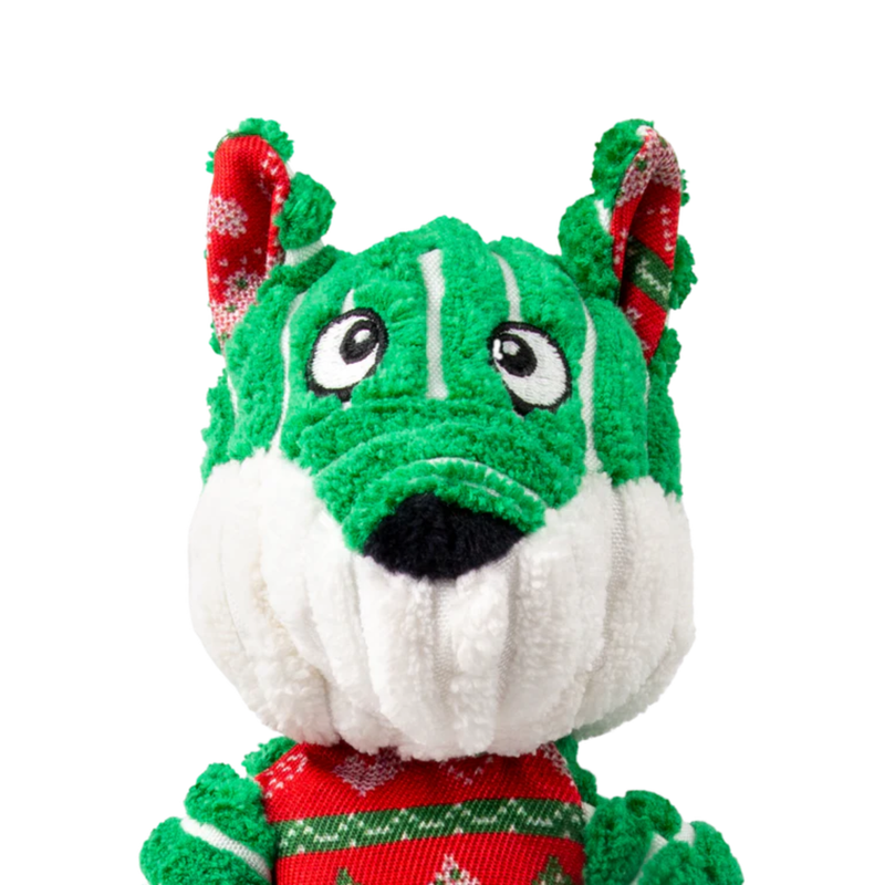 Close up of green, red and white stripy fabric and rope Fox Dog Toy with Christmas tree fabric ears and belly. 