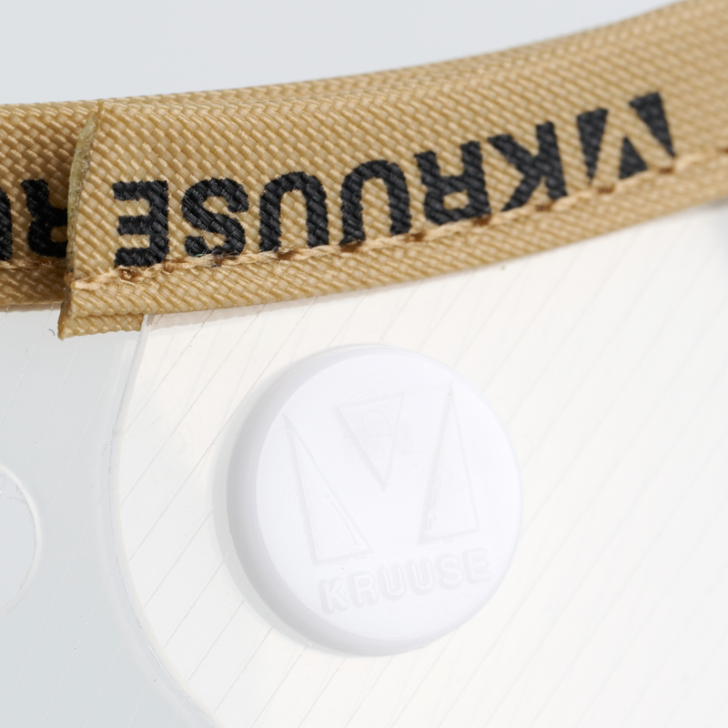 White background with a close up of an Elizabethan style transparent plastic recovery collar with a beige fabric trim at the base. 