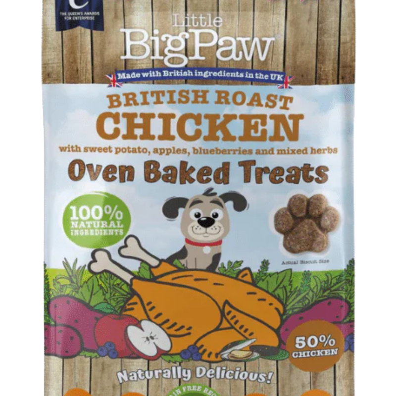White background with a close up of a packet of Little BigPaw 'British Roast Chicken with sweet potato, apples, blueberries and mixed herbs' dog treats. Pictured on the packet is an illustration of a grey dog with a cooked chicken, fruit and vegetables in the foreground. Text on the bag says 'Oven Baked Treats, 100% natural ingredients, Naturally delicious! 50% chicken'. 