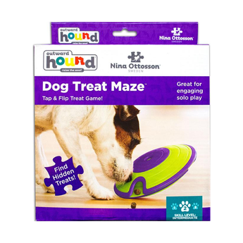 Nina Ottosson Dog Treat Maze toy in its original retail packaging, featuring a dog playing with the purple and lime green toy.