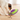 Jack Russell terrier dog playing with a purple and lime green Nina Ottosson Dog Treat Maze toy with dog treats shown spilled out.