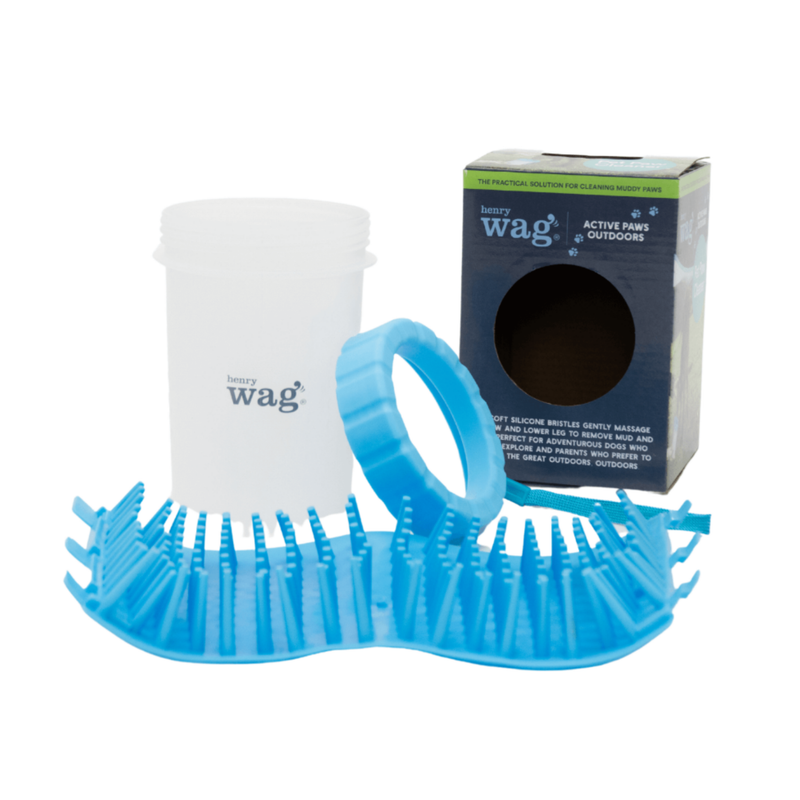 White background with a deconstructed Henry Wag pet paw cleaner with the box pictured in the background. 