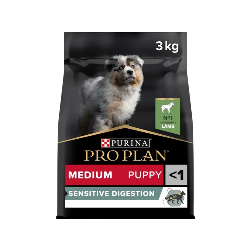 White background with a black bag of Purina Pro Plan Medium Puppy Sensitive Digestion. Pictured on the bag is an collie puppy. 