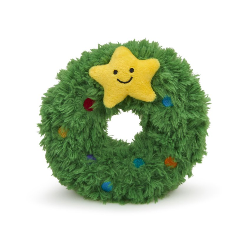White background with a front view of a plush dog toy Christmas wreath with a plush star with stitched eyes and smile. 