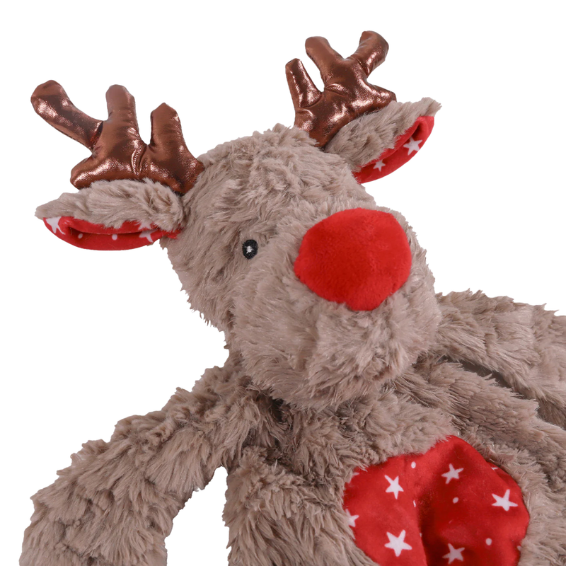 White background with a close up of a brown reindeer plush dog toy with red fabric with stars on the belly and inner ears, a red nose with stitched eye details and metallic antlers. 