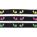 White background with three cat collars pictured. The collars are black with reflective cat eyes along the strap in either purple, green or yellow. 