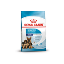 White background with a blue bag of Royal Canin Mother & Babydog. Pictured on the bag is an adult German Shepherd dog and two puppies, text on the bag states '1-2months, Maxi, Adult weight 26 - 44kg'. 