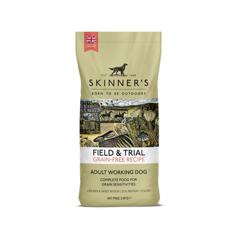 A bag of Skinner's Field & Trial Grain Free Chicken and Sweet Potato dog food for adult working dogs, featuring a beige packaging design with a central illustration of a hunting scene.