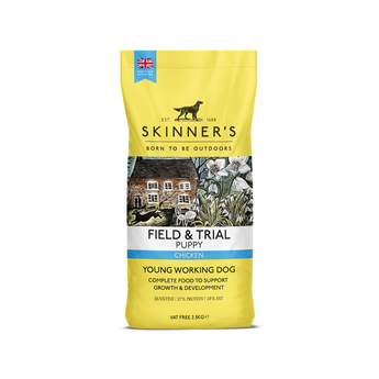 A 2.5kg bag of Skinner's Field & Trial Puppy Chicken dog food, designed for young working dogs, featuring yellow packaging design with a central illustration of a rustic cottage. On a white background.
