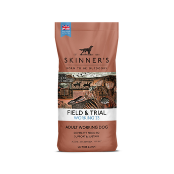 A bag of Skinner's Field & Trial Working 23 Adult Working Dog food, featuring a terracotta brown packaging with an illustration of horses and a white band across the middle.