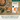 YuMOVE Urinary Support for cats on a wooden surface with cat food and capsules.