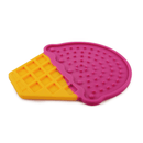 Silicone ice cream shaped lick mat with a pink top with a yellow waffle cone detailed bottom, lying flat on a white background. 
