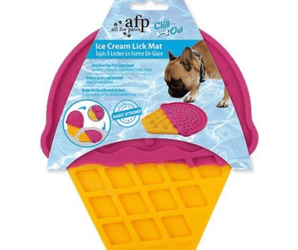 Silicone ice cream shaped lick mat with a pink top with a yellow waffle cone detailed bottom pictured with a blue cardboard sleeve which has a brown dog pictured using the lick mat. Text on packaging says 'Ice Cream Lick Mat' and 'Easily attached'. 