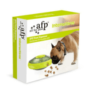 Brown dog pictured with UFO shaped treat dispenser with green central and top parts with main body in grey on a box. Top of the box has text 'all for paws' and 'afp' in black, with 'interactives' written in green. Green banner on the box says 'UFO Treat Dispenser'. Box is on a white background.