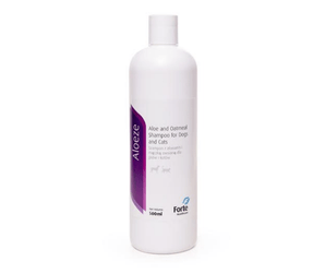 White background with a white and purple bottle of Aloeze Pet Shampoo. Text on the bottle states 'Aloe and Oatmeal Shampoo for Dogs and Cats'. 
