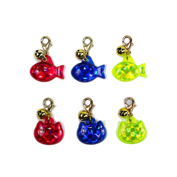White background with two rows of three reflective reflective ID tags three fish shaped and three cat shaped, in blue, yellow and red.