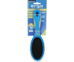 White background with a small blue and grey Ergo Soft Bristle Brush for dogs attached to a cardboard packaging. 