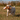 Yellow Labrador dog carrying an Ancol Heritage plush weasel toy with brown fur, a white chest, and plaid patterned ears, pictured outdoor in a field. 