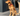 Golden Retriever sat on a decking, wearing a red Ancol Padded collar with a metal buckle and D-ring.