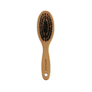 White background with a wooden Ergo Soft Bristle Brush for small dogs, puppies and cats. 