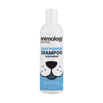White background with a white and blue 250ml bottle of Animology Essentials Baby Powder Shampoo for Puppies. On the bottle is an illustrated muzzle with white text below 'Mild and gentle shampoo to clean, deodorise and condition.' 