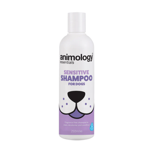 White background with a white and lilac 250ml bottle of Animology Essentials Sensitive Shampoo for Dogs. On the bottle is an illustrated muzzle with white text below 'Fragrance free shampoo to clean, deodorise and condition.' 