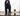 Black cocker spaniel dog dripping wet, stood on a tiled area, next to a black and yellow bottle of Animology Fox Poo Dog Shampoo.