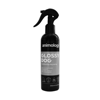 White background with a black and grey spray bottle of Animology Glossy Dog. On the bottle is white text 'Animology Glossy Dog, Conditioning dog spray'. 