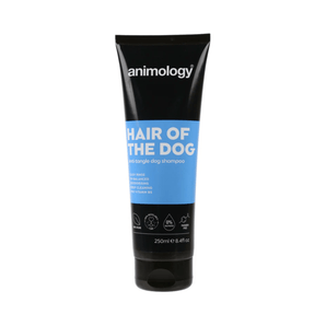White background with a black and blue bottle of Animology Hair of the Dog Shampoo. On the bottle is white text 'Animology Hair of the Dog, Anti-tangle dog shampoo'. 