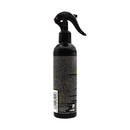 White background with a back view of a  black and yellow spray bottle of Animology Pre-Wash Fox Poo. 