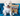 West Highland terrier dog sat on a blue velvet sofa with a stripy cushion behind it. A black and blue bottle of Animology Tear Stain Remover is also on the sofa.