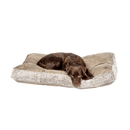 Brown mixed breed dog lying on a pillow-type brown faux suede dog bed with faux fur trimming. 