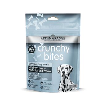 A stand-up pouch of Arden Grange Crunchy Bites sensitive dog treats, featuring a light blue and gray design with a Dalmatian graphic on the front, set against a plain white background.